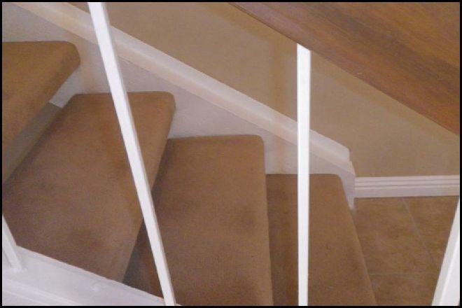 The balusters in the stair guardrail are more than four inches apart and are not child