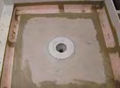 b When KERDI-DRAIN must be set by the plumber prior to the mortar bed (or when there is no access to the plumbing from below), the KERDI-DRAIN is connected to the waste line and set at the desired