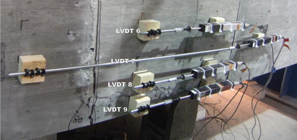 orientation of the instrumentation. LVDTs 6, 8, and 9 spanned a distance of 12 in. and LVDT 7 spanned 36 in. The bottom LVDT was oriented to record the opening between the two flange tips.