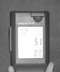Close the luminometer (Figure 8) and push the Power button. The instrument will calibrate itself by a 10 seconds countdown visible on the display, followed by a beep signal. N.B.