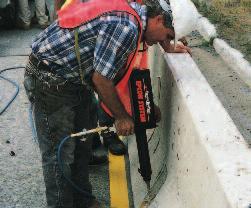 APPLICATIONS Anchoring a concrete traffic barrier wall to concrete bridge deck.