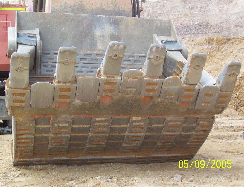 Tungsten Carbide / Postalloy PS 98 Application of MIG TUNGSTEN CARBIDE on loader and shovel tips enables them to be kept in service longer, resulting in more
