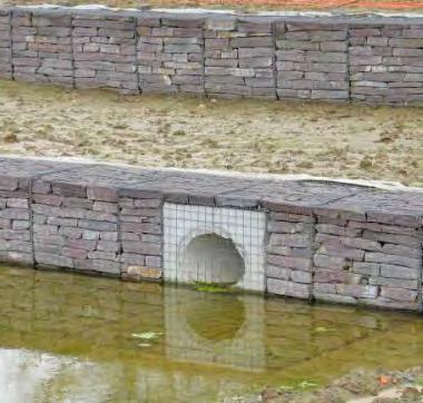 Outfall structures can be constructed from gabions, designed as a retaining wall having the discharge or inlet pipe pass through the retaining wall.