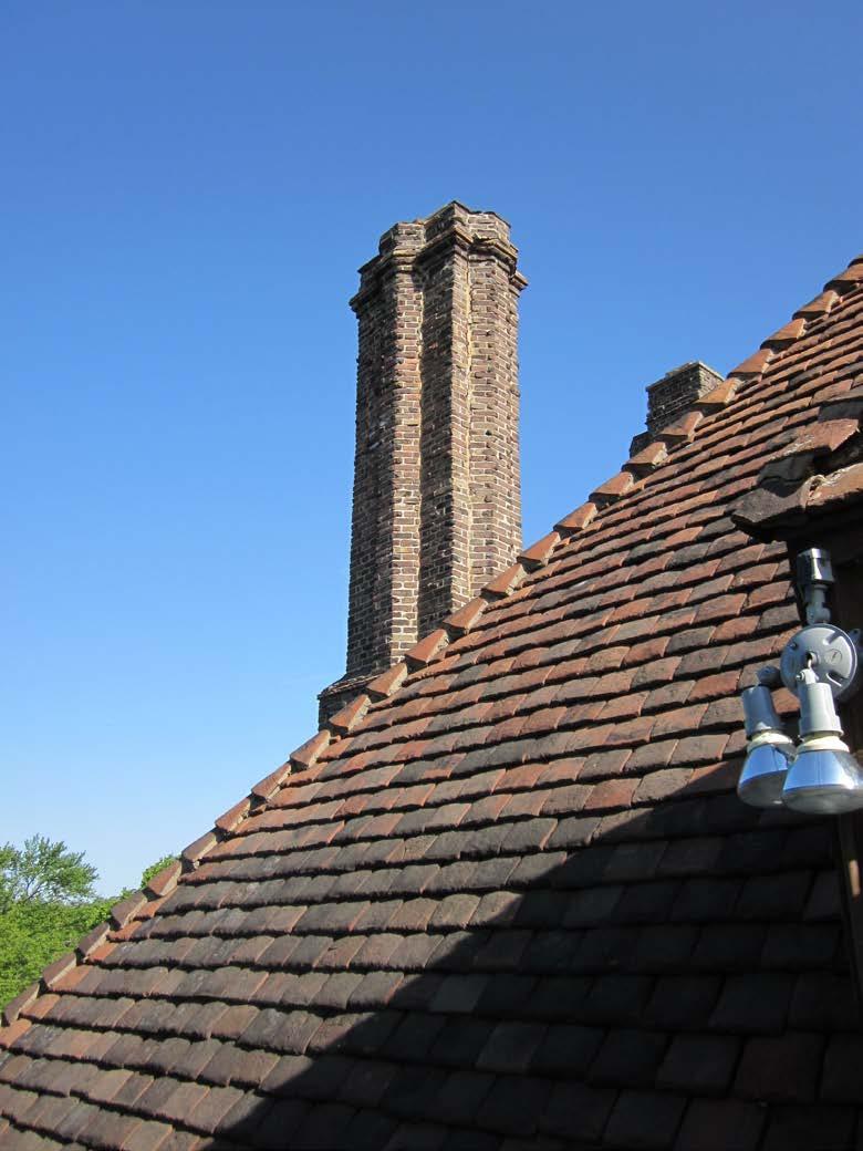 Photo 7 View of roof tiles and chimney, south elevation.