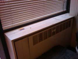 Encapsulated and labelled insulating board panels to underside of window cills.