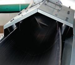 The belt conveyor can as standard be inclined up to 20 without loss of capacity. The belt is a trough formed unit which runs on duplex or triple support rollers.