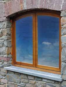 Originally they had intended to install solid Oak windows and doors in a natural Oak finish, but after conservation officers required all the exterior frames to be painted in a dark opaque finish,