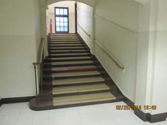 12" Top handrail extension not parallel to ground surface Rec. Solution: Provide handrails at both sides of stairway Barrier Severity: 2 Recommended Cost Est $0.