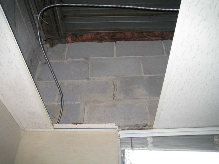 PHOTOGRAPH 8 Interior view of masonry wall cracks