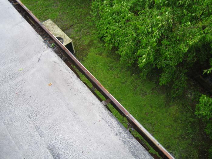 PHOTOGRAPH 12 Deteriorated gutter at south side of west