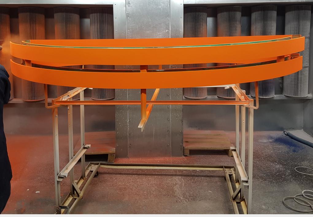 (Image depicts safety yellow and orange textured powder coatings applied onto FRP hand rail connector components) Powder
