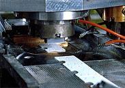 A carbon mold is filled with raw powder, which is then heated and pressurized
