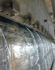 AIR CONVEYOR Air conveyor for PET Bottles Air flow on the bottle neck Bottles are transfered on the conveyor with a controled air flow on the bottle neck.