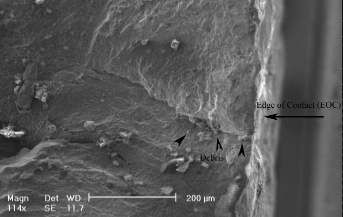 Figure 6: Micro-fractography of the 1 st cracked blade fracture surface showing the appearance of main crack and compact debris in mouth of crack.