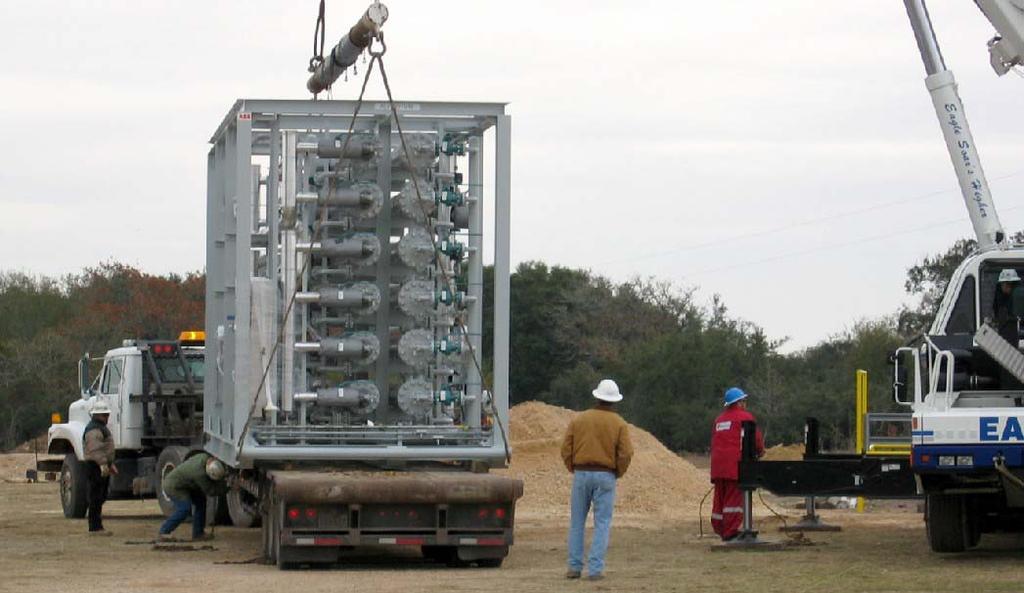 Figure 5. A standard membrane-based CO 2 treatment unit is lifted from the truck. A few additional considerations include the following: Ease of Installation. All major equipment is skid mounted.