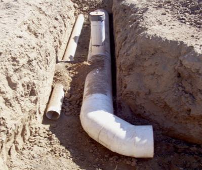 is smoother than concrete so the same pump head pressure will push water further because there is less friction loss.