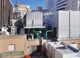 ABOVE Cogeneration system with new and existing cooling tower and power house. LEFT Cogeneration system looking north.