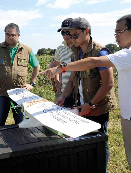 THE PHILIPPINES FAO representatives leading the launching of drones that will support disaster risk reduction efforts in the agriculture sector. FAO/J.