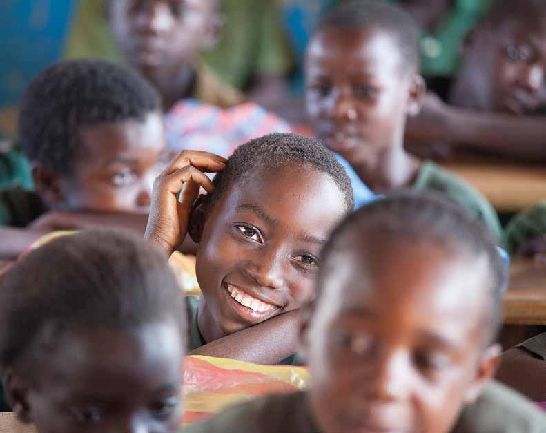 ZAMBIA Children at school. The Social Cash Transfer Programme has helped beneficiary households pay for school food and buy new uniforms for their children.