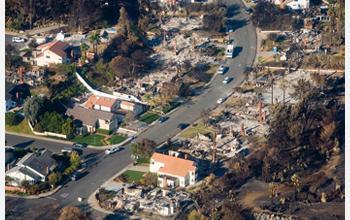 Even after seeing images like this one where a wildfire tore through a scenic California neighborhood in 2007, some people will continue to choose to live in high risk areas.