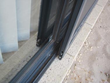 14) Family Room sliding door is off its track.