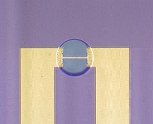 A second capping wafer is coated with 1900-Å of stoichiometric silicon nitride. In order to assure uniformity across the wafer, this layer is chemically-mechanically polished back to 1500-Å.