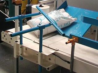 conveyor exiting with the bag top