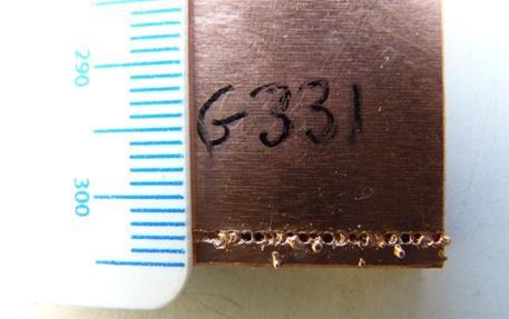 a) b) Figure 39 Example of indication of a good copper to copper weld: a) Surface of sample G339 (good weld); b) Screen display on scan.