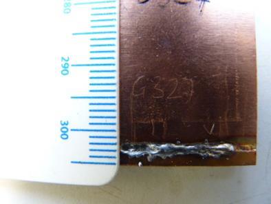 a) b) c) Figure 42 Indication from a poor copper to aluminium weld: a) Surface of sample; b) Crack in surface; c) Indication.