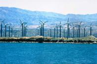 The turbines sit high atop towers, taking advantage of the stronger and less turbulent wind at