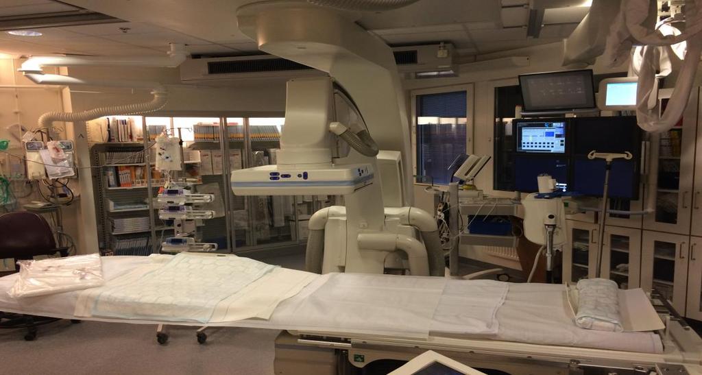 1.1 X-ray equipment for image-guided procedures Image-guided procedures are usually performed in angiographic suites using a C-arm. The suite showed in figure 1 is a typical examination room.