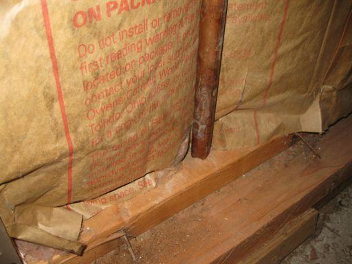 Compressed insulation due to pipe placement within the wall cavity will cause air gaps and