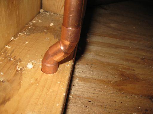 Stud Penetrations are required by code to be no more than 5/8 of an inch from the edge in structural walls.