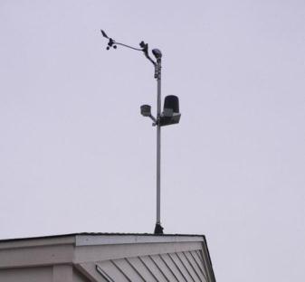 A steel mast on the roof of the test facility supports a weather station at a height of 22 ft (6.7 m) above the roof of the office building and 50 ft (15.24 m) above ground level.