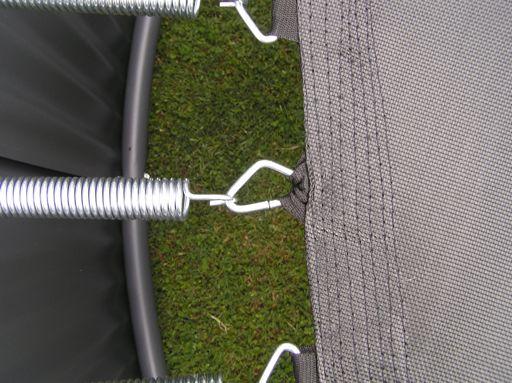 (See photo) Make sure the tight hook is attached to the jump mat first and then using the