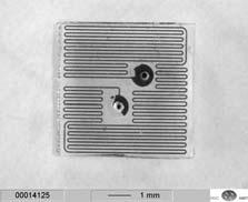with ink for reasons of visualization. The entire fluidic chip measures 6x6x2mm 3. Fig.8: Fluidic seal monolithic capillary structures in PDMS, filled with ink.