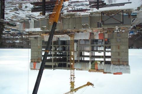 Figure 1 illustrates the east face view of the ECERF building at the completion of the concrete superstructure.