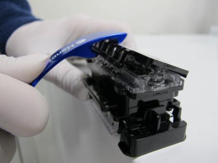 Do not remove the Test Cartridge cover until immediately prior to inserting the Test Cartridge into the