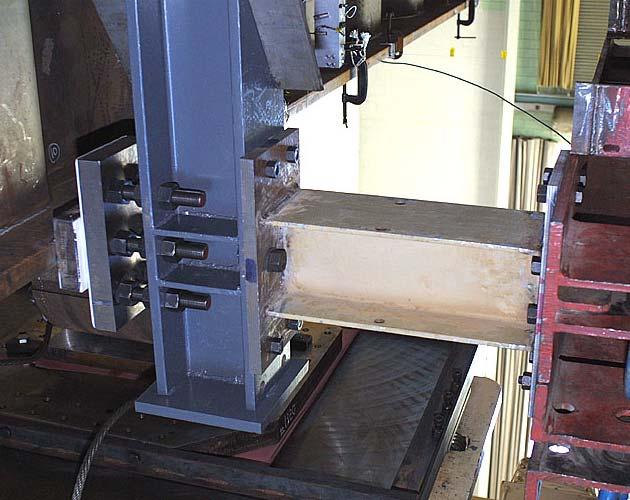 In order to prevent lateral-torsional buckling, two lateral braces, one on each side of the test specimen, were provided at approximately 700mm (28in) from the load point.