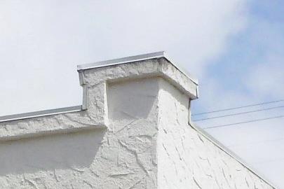 Composition shingles are not appropriate for a Spanish Colonial Revival style residence, and their installation is not permitted in the Minerva Park Place Historic District.