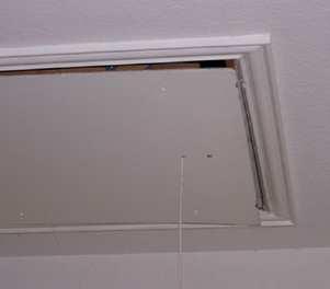 Pull-down attic stair: Install weather stripping where the panel of the stair meets the frame. Install a latch to reduce the size of the gap and to force the panel against the weather stripping.