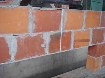 In wall 3, there was failure in the form of a ladder in the corner with visible loss of adhesion between the mortar