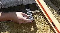13 When marking body pavers along the retaining wall, we used a tool called a