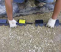 Since the pavers need to be cut, setting the edge restraint first will help create a smooth curve and is also a good time for the homeowner to approve the design.