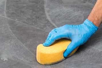 taking care not to remove the grout.