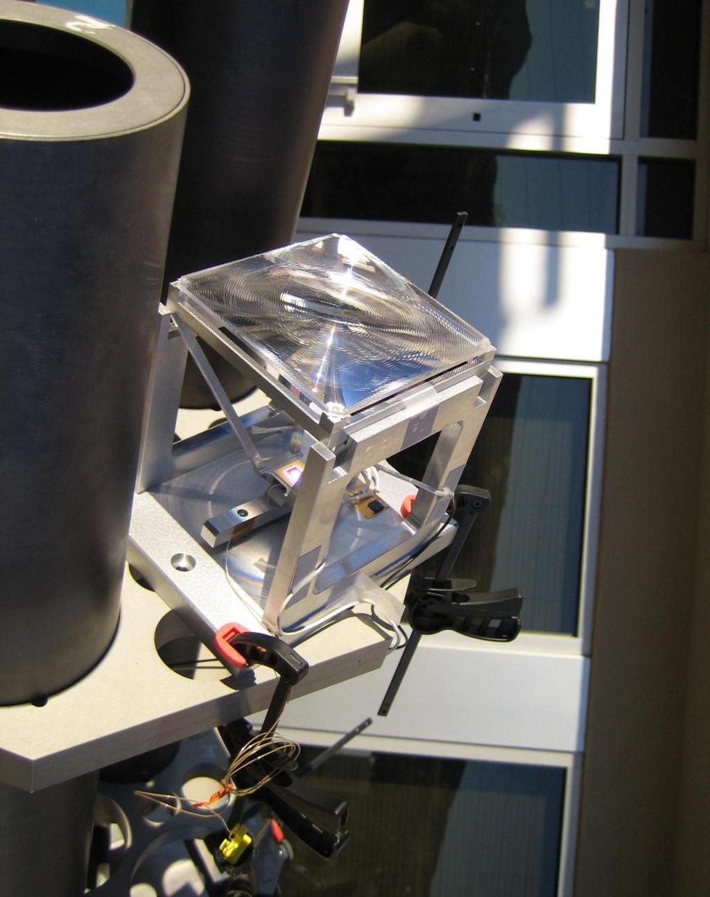 Concentrating solar cells (cont.) Shown at left: Enfocus Engineering two-axis tracking CPV single-cell component, under test conditions at NREL.