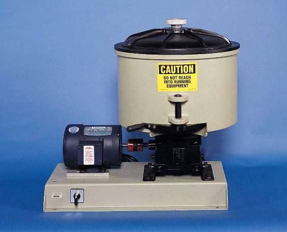 The muller weight can be adjusted by a single load spring. The muller has a capacity of 4.1 kgs. (9 lbs.) of silica molding sand and operates with a 0.75 horsepower motor.