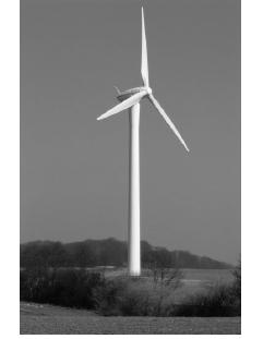 Wind Turbines A wind turbine is a rotating machine which converts the wind kinetic energy into mechanical energy.
