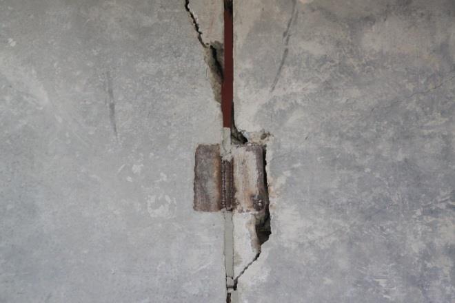 The residual drift in the walls panels is clearly identifiable and is consistent with the