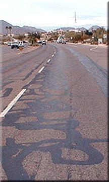 Crack Type - Fatigue (alligator) Definition: Caused by repeated traffic loading Occurs in heavy traffic areas and wheel paths.